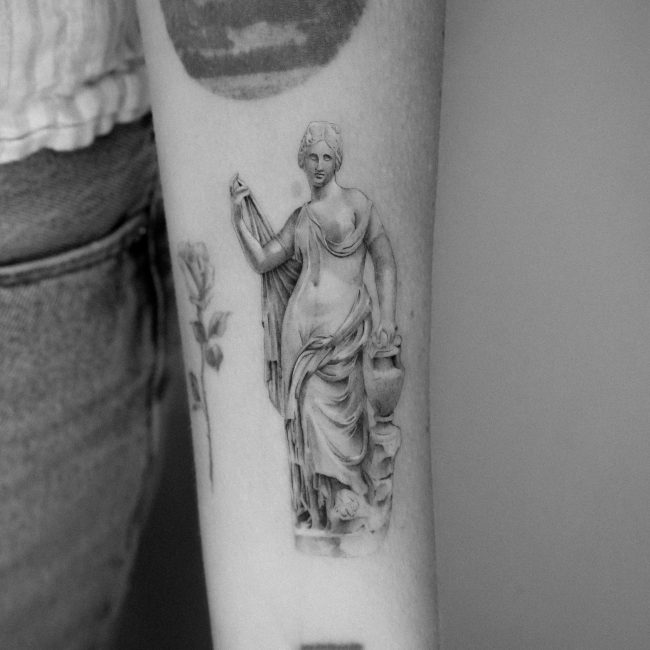 Fine line Aphrodite statue tattoo done by Kane Navasard in Los Angeles.