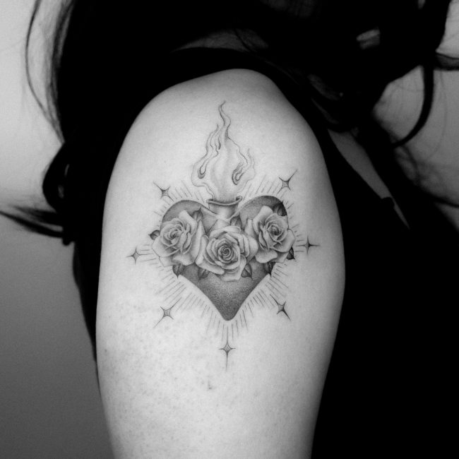Single needle sacred heart tattoo done by Kane Navasard