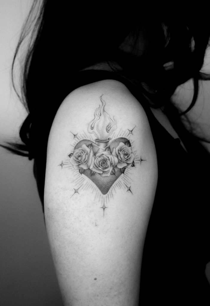 Single needle sacred heart tattoo done by Kane Navasard
