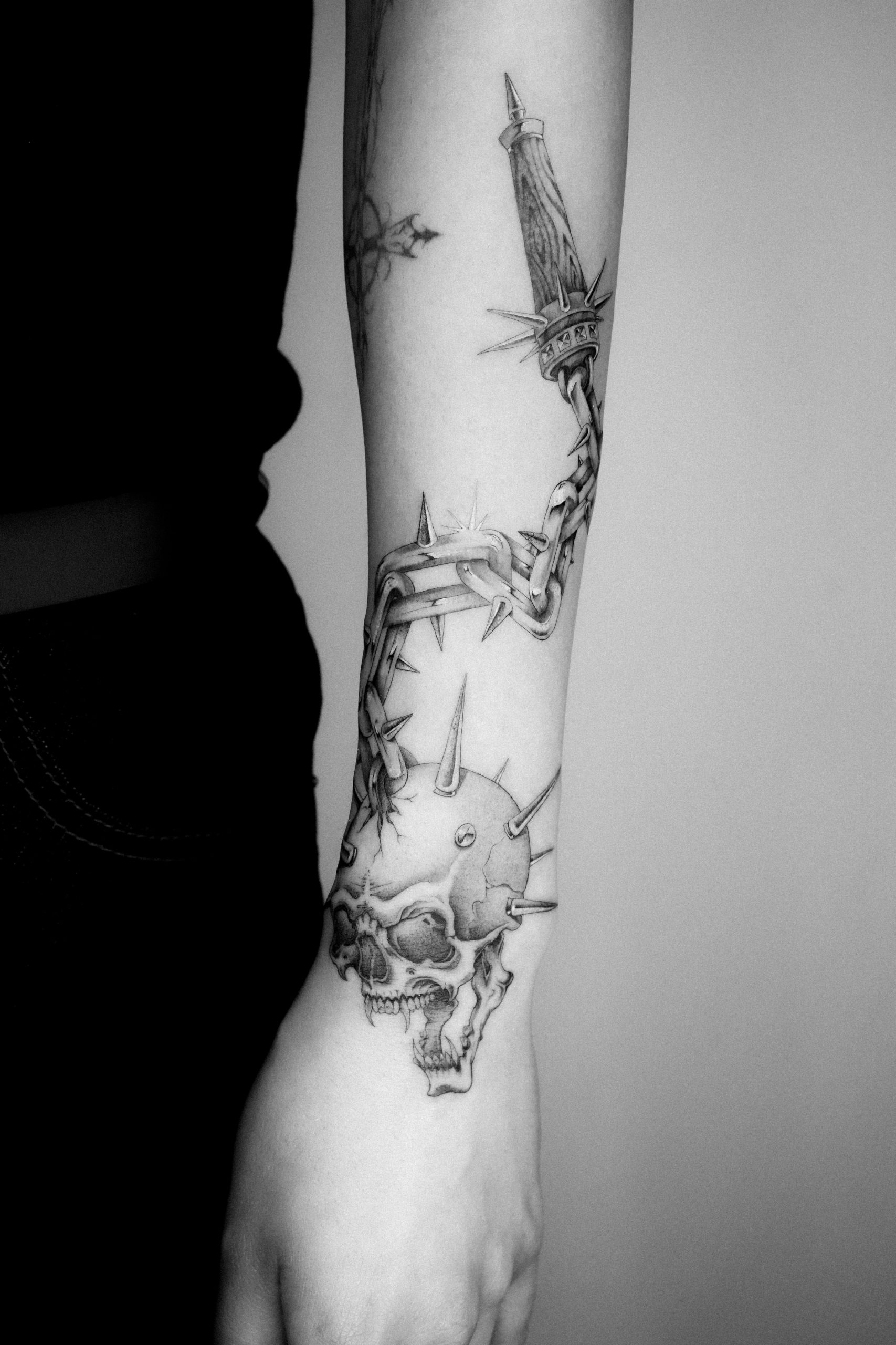 Single needle flail tattoo by Kane Navasard