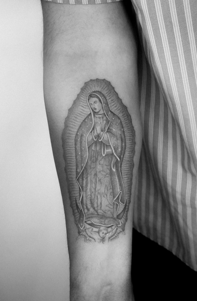 Fine line Virgin Mary Tattoo by Kane Navasard done in LA